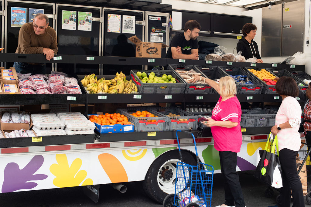 Shop for farm-fresh fruits, vegetables, and eggs at our mobile market truck. Friendly local vendors are ready to help as you browse the colorful displays. Stop by and pick up healthy produce—look for the truck with happy customers and a blue shopping cart in front!.