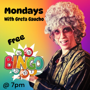 Greta Gaucho rocks a curly gray wig, shades, and retro style against a lively backdrop—join our free Monday bingo at 7pm!.