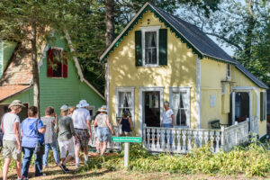 Neighbors mingle and explore by the vibrant Martha Green Novick Cottage, celebrating Essex Heritage’s Trails & Sails spirit together.