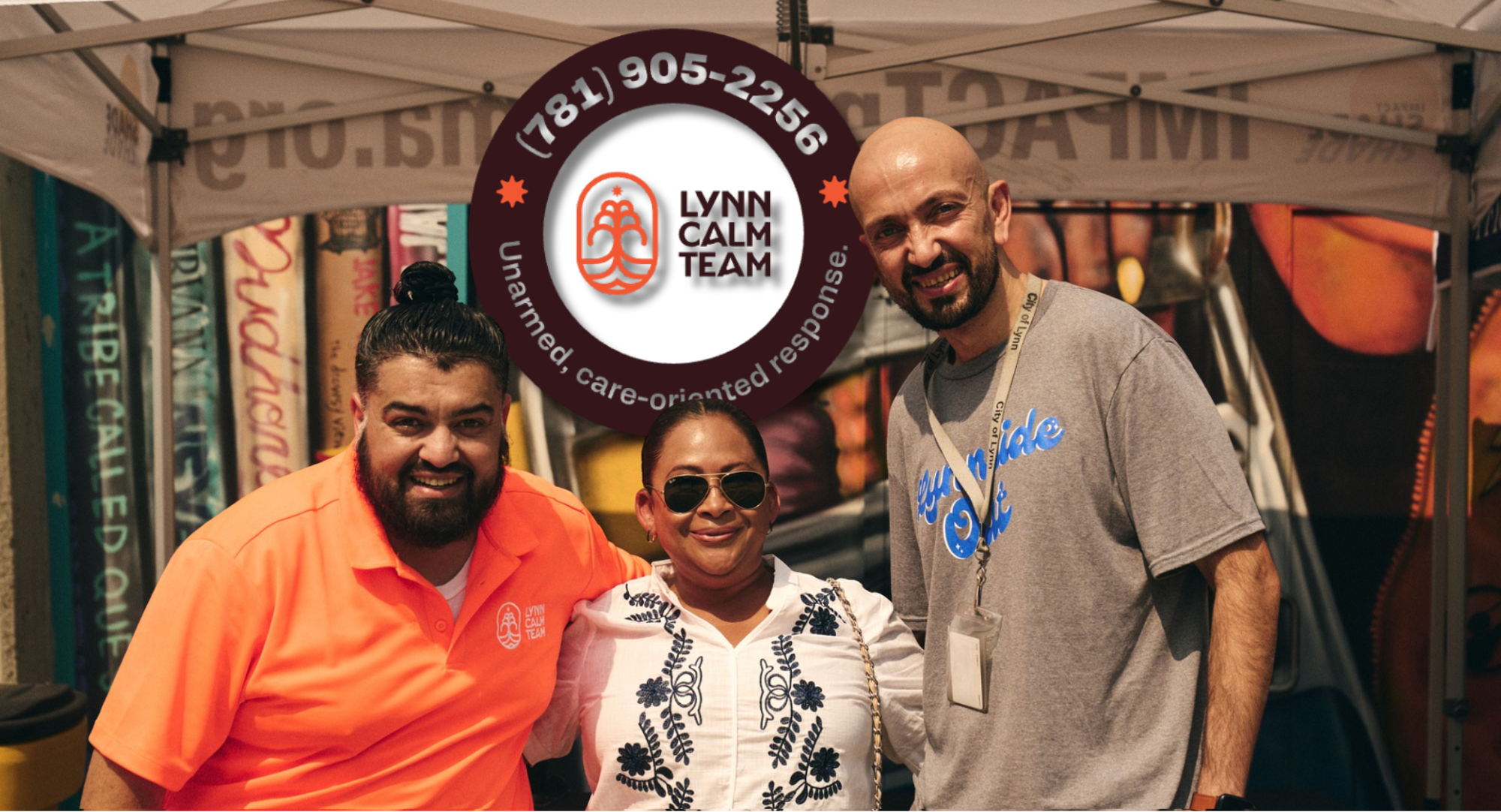 Three smiling community members under a canopy and Lynn Calm Team logo, with “Unarmed, care-oriented response.” A vibrant mural behind celebrates Essex County’s creative spirit.