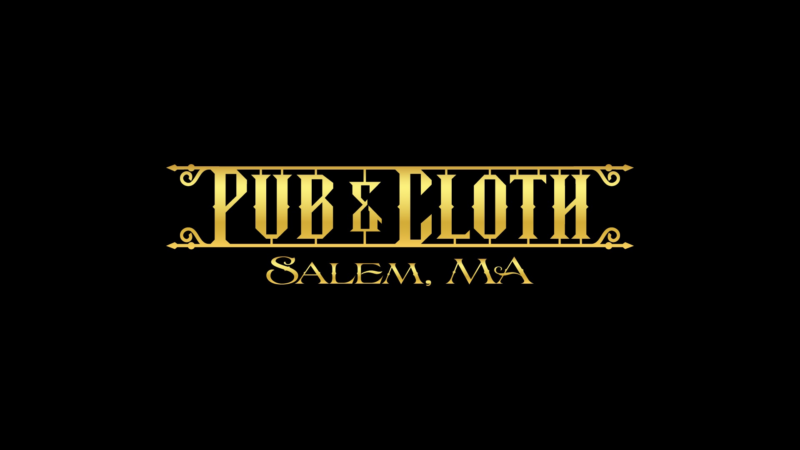Radiant gold lettering on black says “PUB & CLOTH,” celebrating Salem, MA’s creative spirit and Essex County’s vibrant community. Ornamental lines accent the unity.