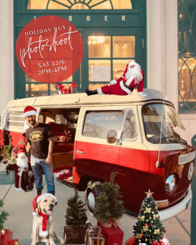 Holiday joy abounds as a man in a Santa hat joins lively Essex County festivities by a vintage van, Santa atop, dog and gifts below.