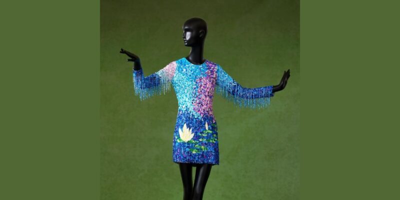 A bold black mannequin shines in a sequined, water lily mini dress with beaded fringe—celebrating Essex County’s vibrant creativity.