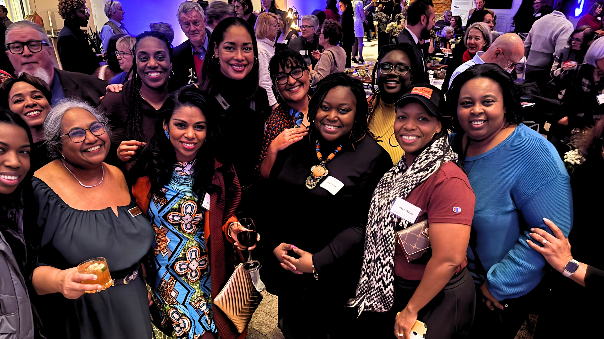 A lively, diverse crowd shares smiles and creativity at an Essex County event, connecting over drinks in a vibrant local gathering at Peabody Essex Museum