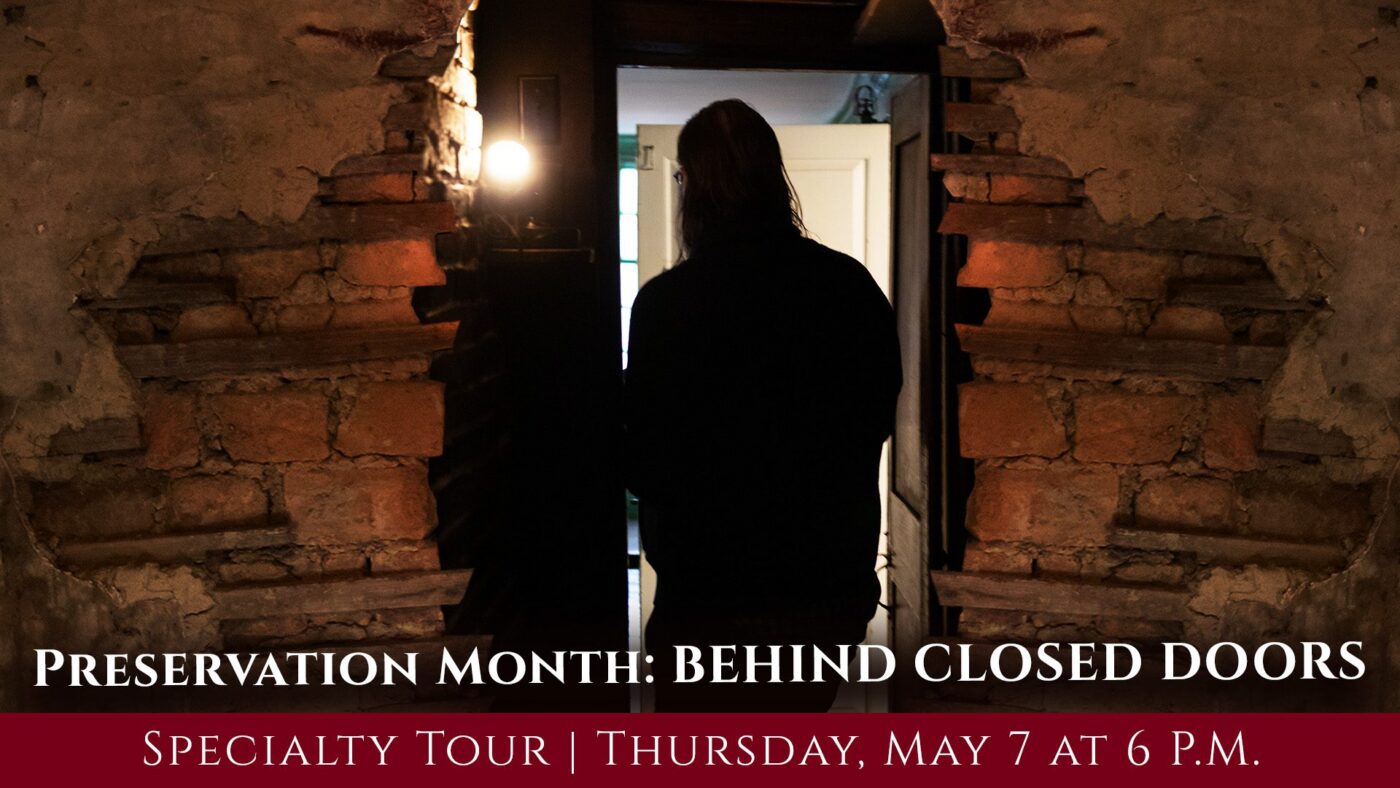 A lively scene: a long-haired local stands in a historic brick doorway, inviting all to Essex County’s creative Preservation Month tour.