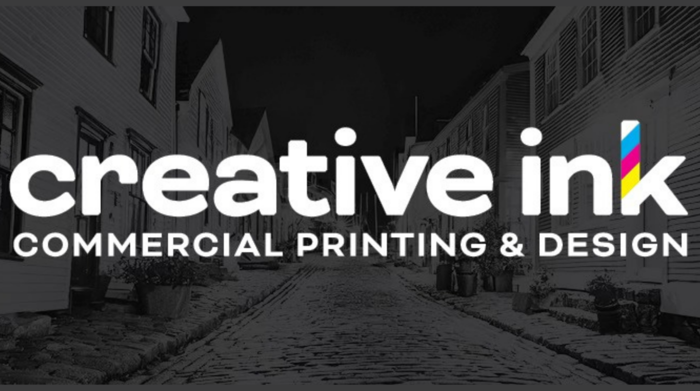A lively cobblestone street in Essex County bursts with “Creative Ink” in bold white, its colorful “k” symbolizing vibrant local creativity.