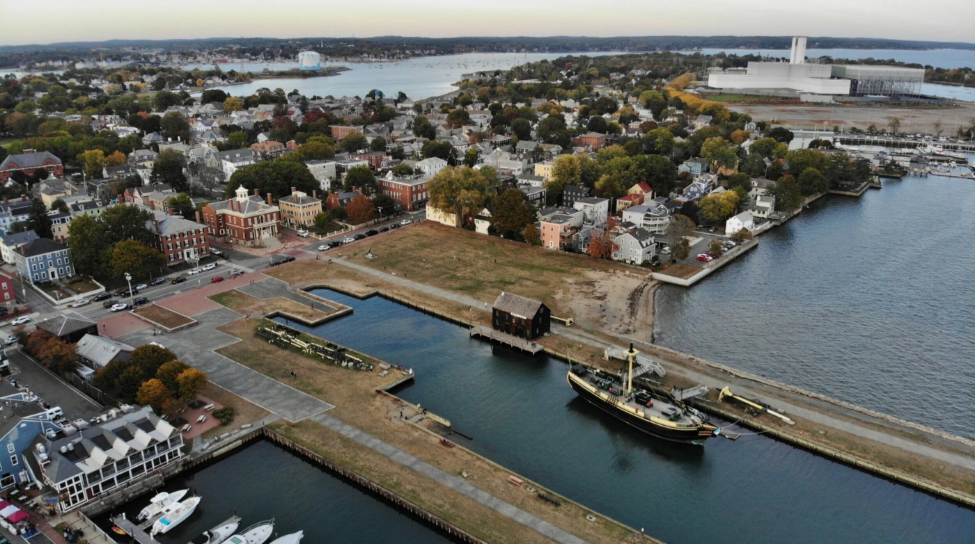 Aerial view of Salem's lively waterfront brimming with historic charm, creative energy, local businesses, and Essex County spirit.