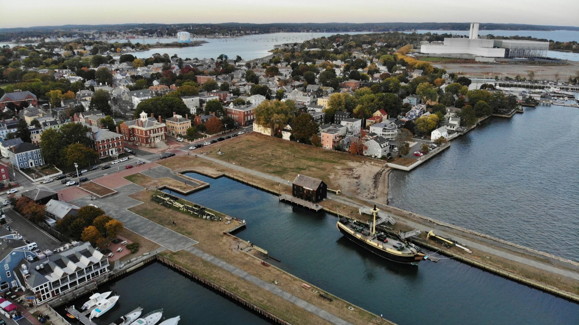 Aerial view of Salem's lively waterfront brimming with historic charm, creative energy, local businesses, and Essex County spirit.