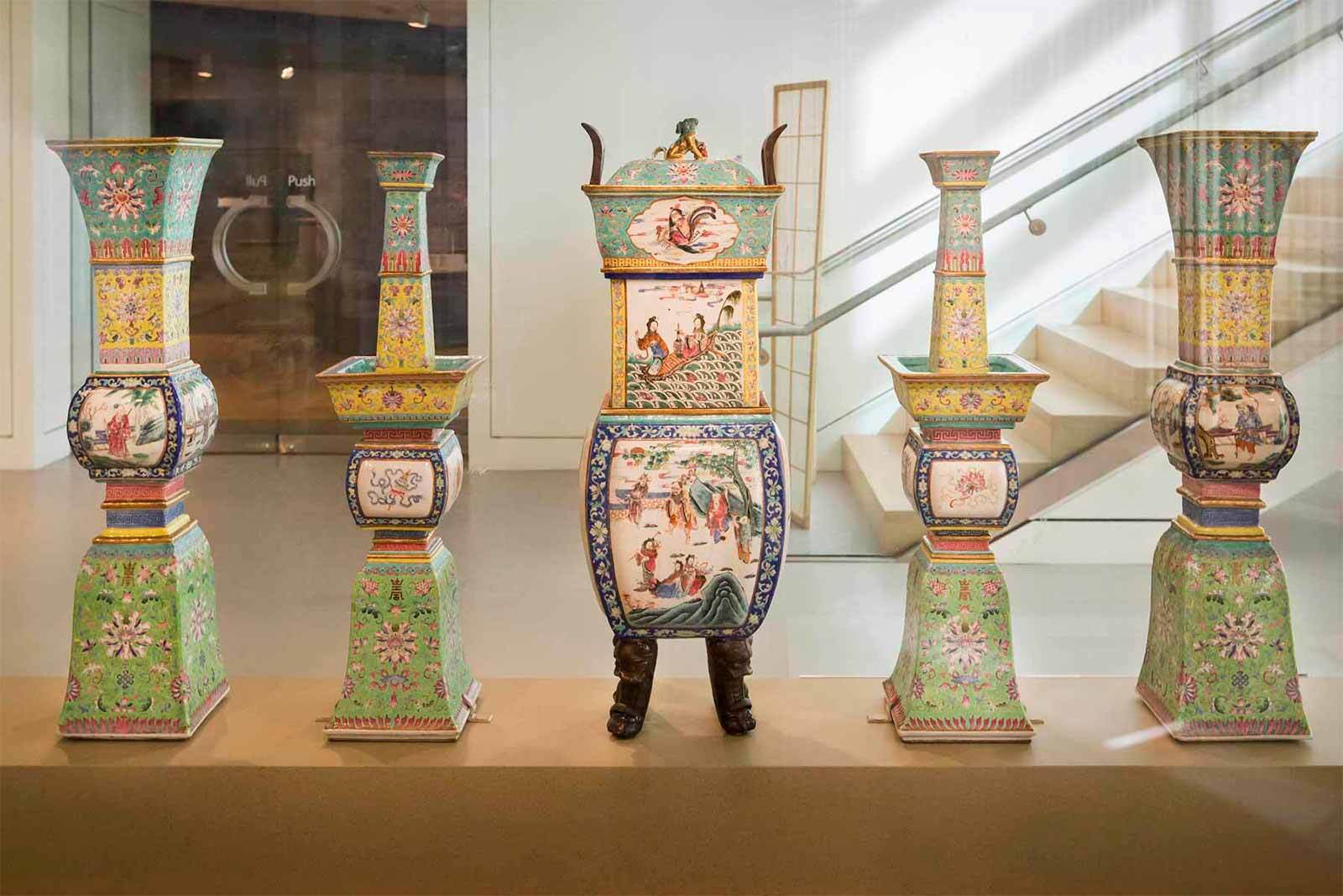 Five vibrant ceramic vessels with bold patterns shine in a museum, celebrating Essex County’s creative entrepreneurs and local unity.