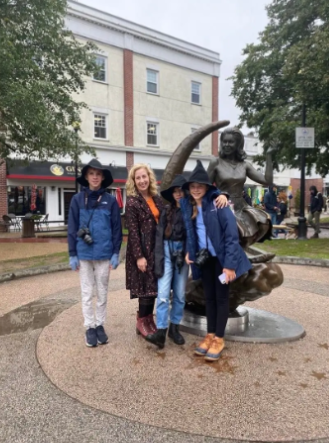 A lively group gathers by Salem’s iconic broomstick girl statue, connecting with our creative Essex County heritage.
