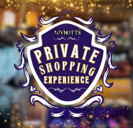 A vibrant purple and gold sign with ornate borders welcomes Essex County to a magical Wynotts Wands shopping adventure together.