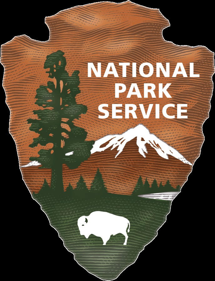 Vibrant arrowhead-shaped National Park Service logo celebrates Essex County’s heritage—tree, mountain, lake, white bison unite community.