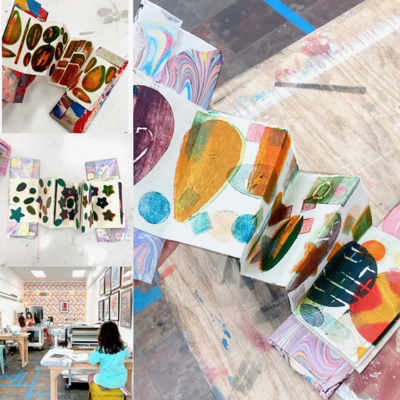 Accordion-style art books decorated with colorful abstract shapes and patterns are displayed on a wooden table; an art studio with children working is visible in the lower left corner of the collage.