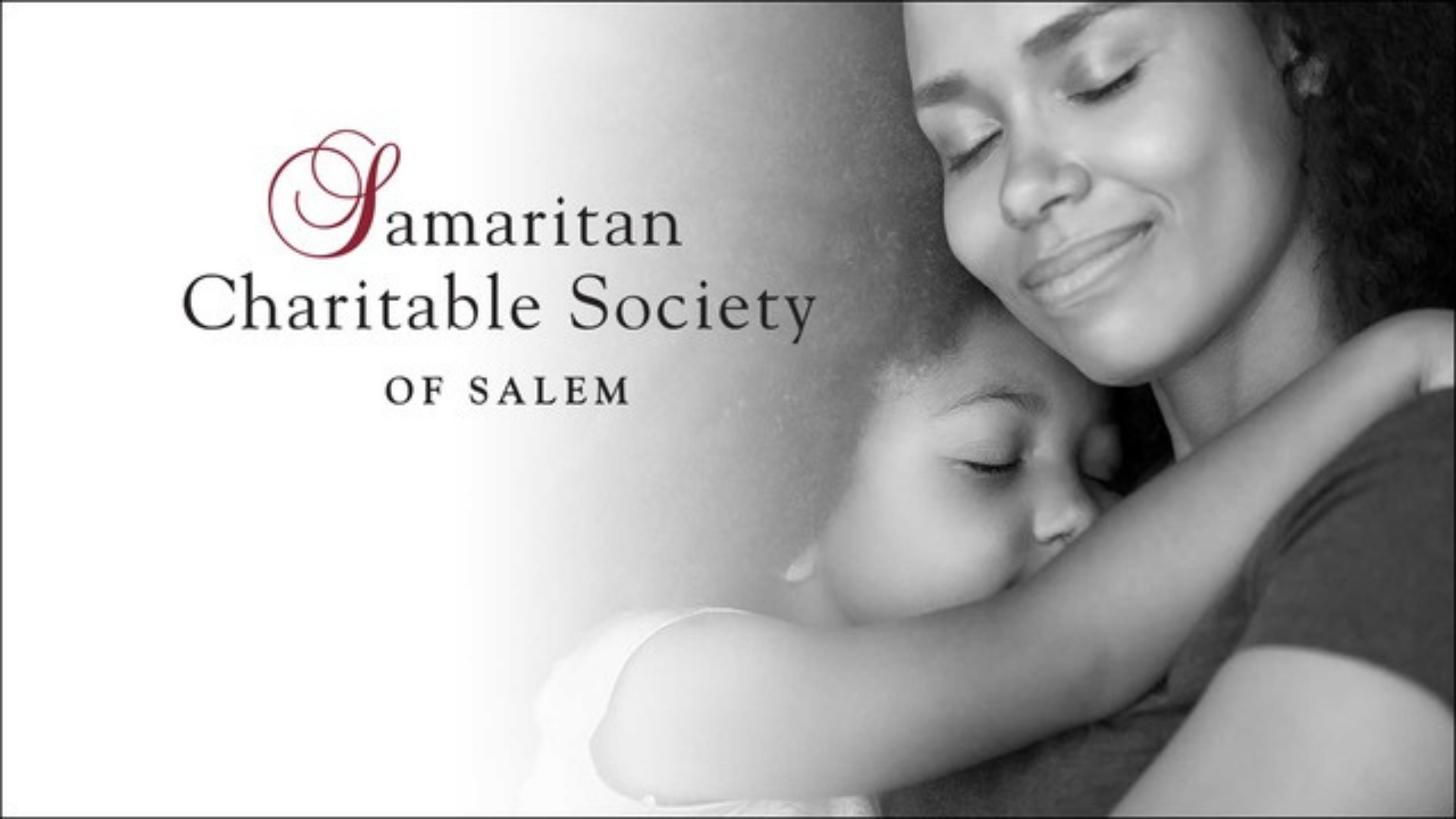 A black and white image shows a woman hugging a child with eyes closed. To the left, the text reads, “Samaritan Charitable Society of Salem.” Both appear calm and peaceful, reflecting the caring mission of this charitable society in Salem.