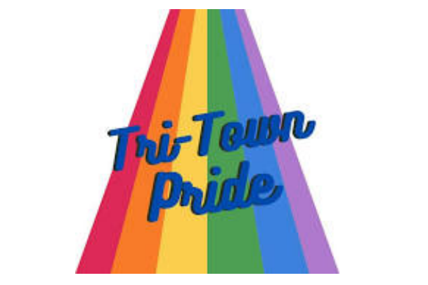 The words "Tri-Town Pride" appear in blue script over a rainbow background, with each color forming a diagonal stripe fanning outward from the text, celebrating the LGBTQ community event.