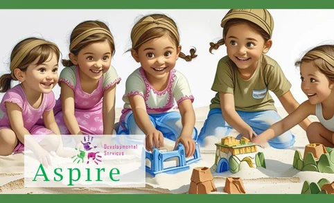 Five children are sitting together in the sand, building sandcastles and smiling. The logo for "Aspire Developmental Services" and "Aspire Meetup Group" is displayed in the bottom left corner of the image.