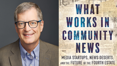 A man with short gray hair and glasses wearing a brown blazer and light blue shirt is next to the cover of a book titled "What Works in Community News: Media Startups, News Deserts, and the Future of the Fourth Estate.