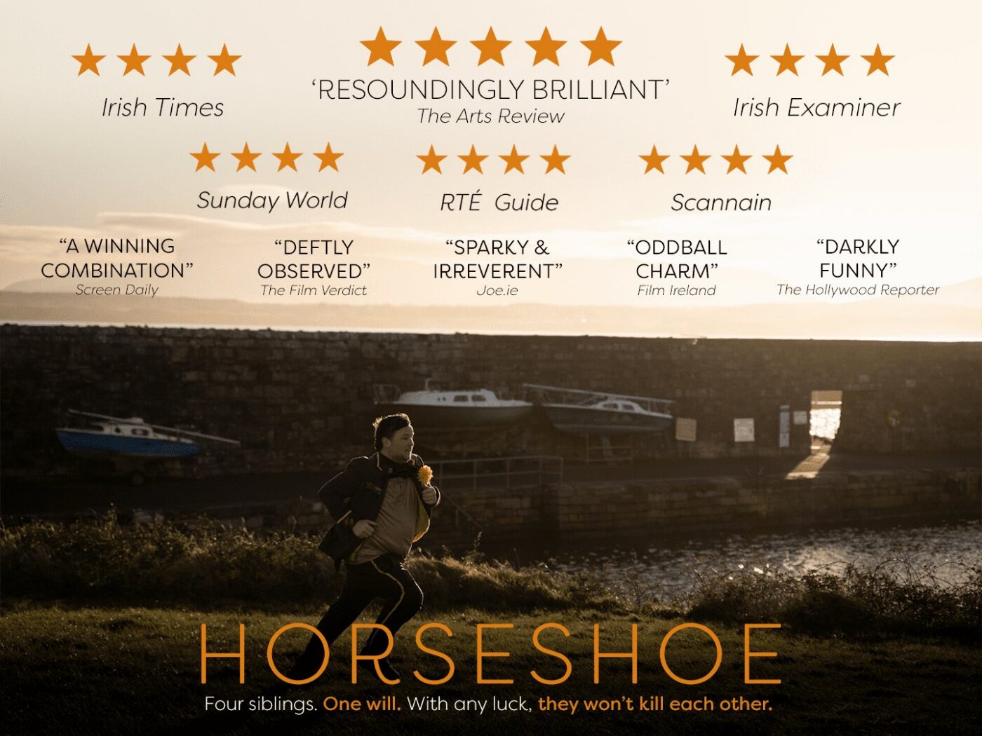 A child runs along a grassy path near a stone wall and body of water at sunset. The text above includes critical praise and star ratings for the film "Horseshoe," with a tagline about four siblings.