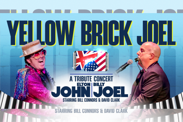 Two men on stage perform as Elton John and Billy Joel; one wears colorful glasses and a sequined jacket while singing, the other plays the piano. Text reads "Yellow Brick Joel: A Tribute Concert." Keyboard graphics and a US flag are in the background.