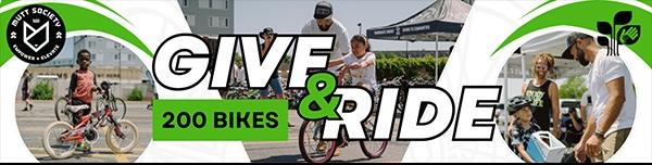 Banner with "Give & Ride" in large text, "200 Bikes" in a green box, and photos of children and adults with bicycles outdoors. Logos appear on both sides of the banner.