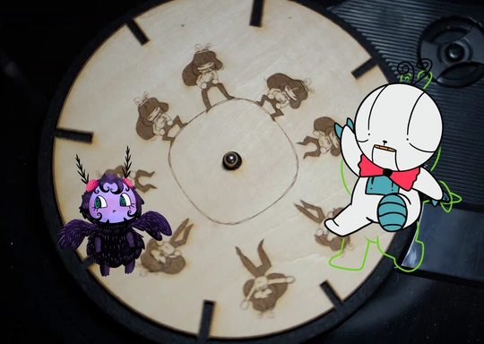 A wood zoetrope disc with drawings of a character in motion is shown. Two colorful cartoon characters—one purple with wings, the other white and green—are digitally added, creating a playful mixed media animation vibe. The disc has black marks around its edge.