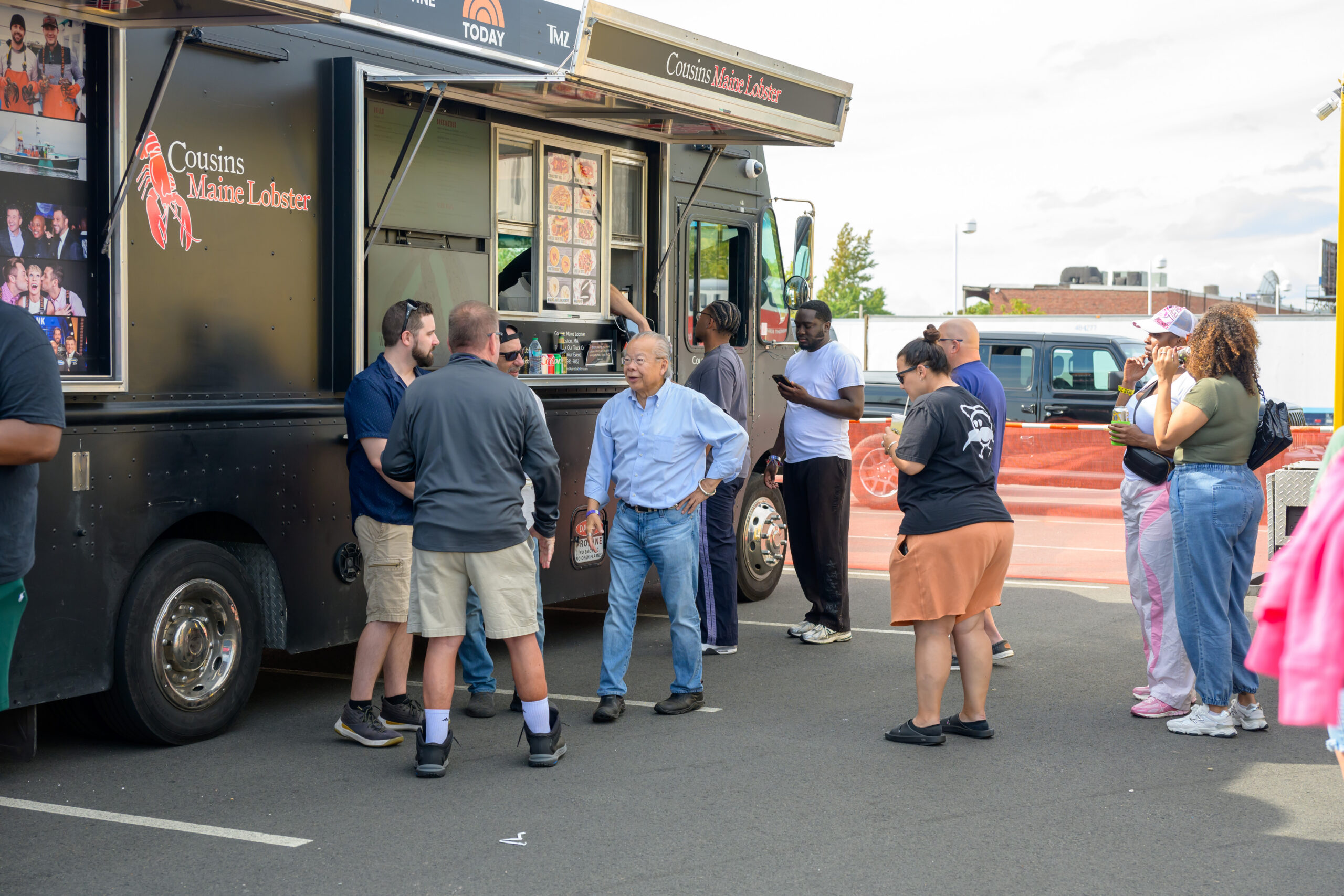 Festivalgoers line up at a food truck during Lynn’s 2025 waterfront festival.