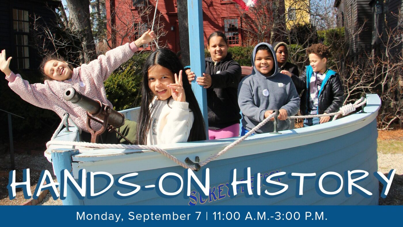 Six children stand and pose on a blue wooden play boat outdoors, some smiling and waving, under sunny skies. Text at the bottom reads: “HANDS-ON HISTORY, Monday, September 7 | 11:00 A.M.–3:00 P.M.”.