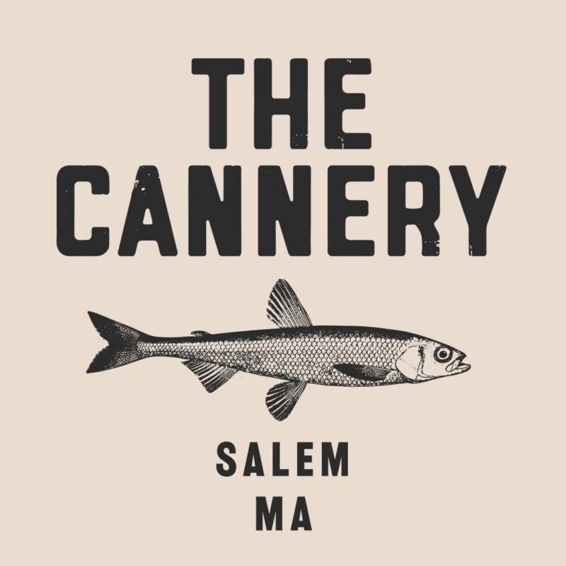 Logo with “THE CANNERY” in bold letters above an illustration of a fish, with “SALEM MA” below. The light beige background adds charm—a perfect spot for Sweet Bangs or Yours Truly gathering memories.