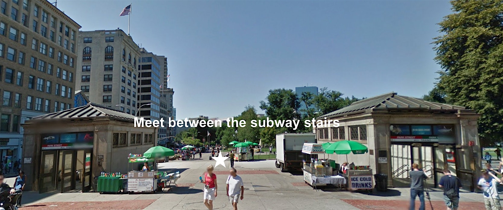 Two subway entrances stand across from each other in a public square with green umbrellas, food stands, and people walking. The words “Meet between the subway stairs” appear in the center of the image. Buildings and trees are in the background.