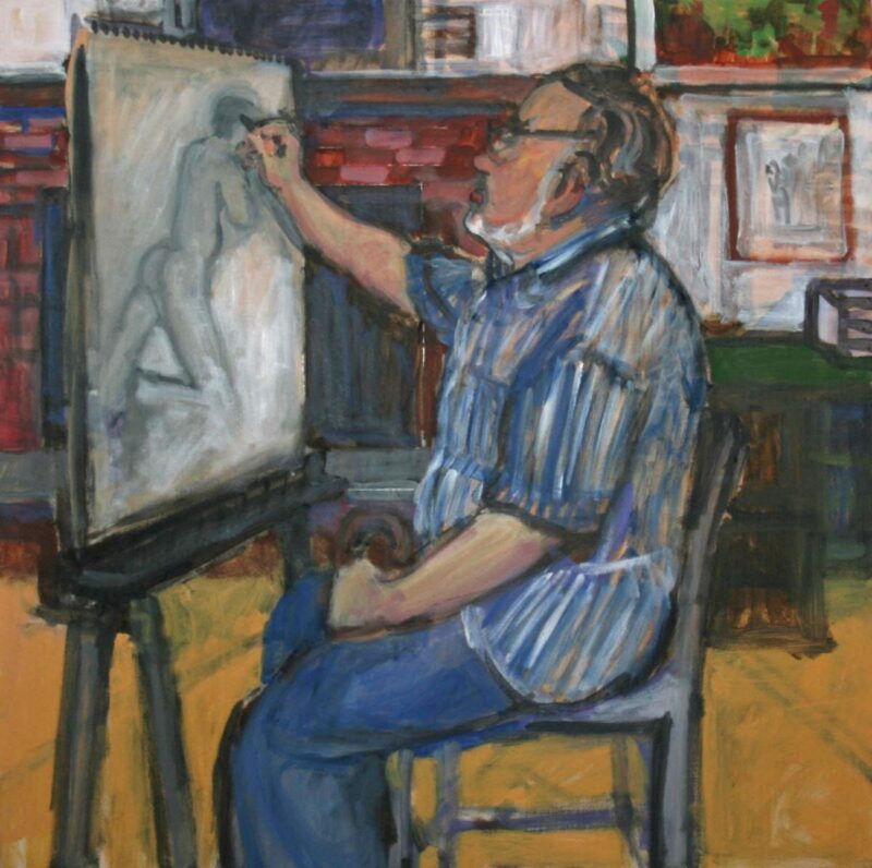 A man with glasses and a beard, wearing a striped shirt and blue pants, sits on a chair and sketches a human figure on a large easel in a colorful, indoors setting. The background includes shelves, books, and framed pictures.