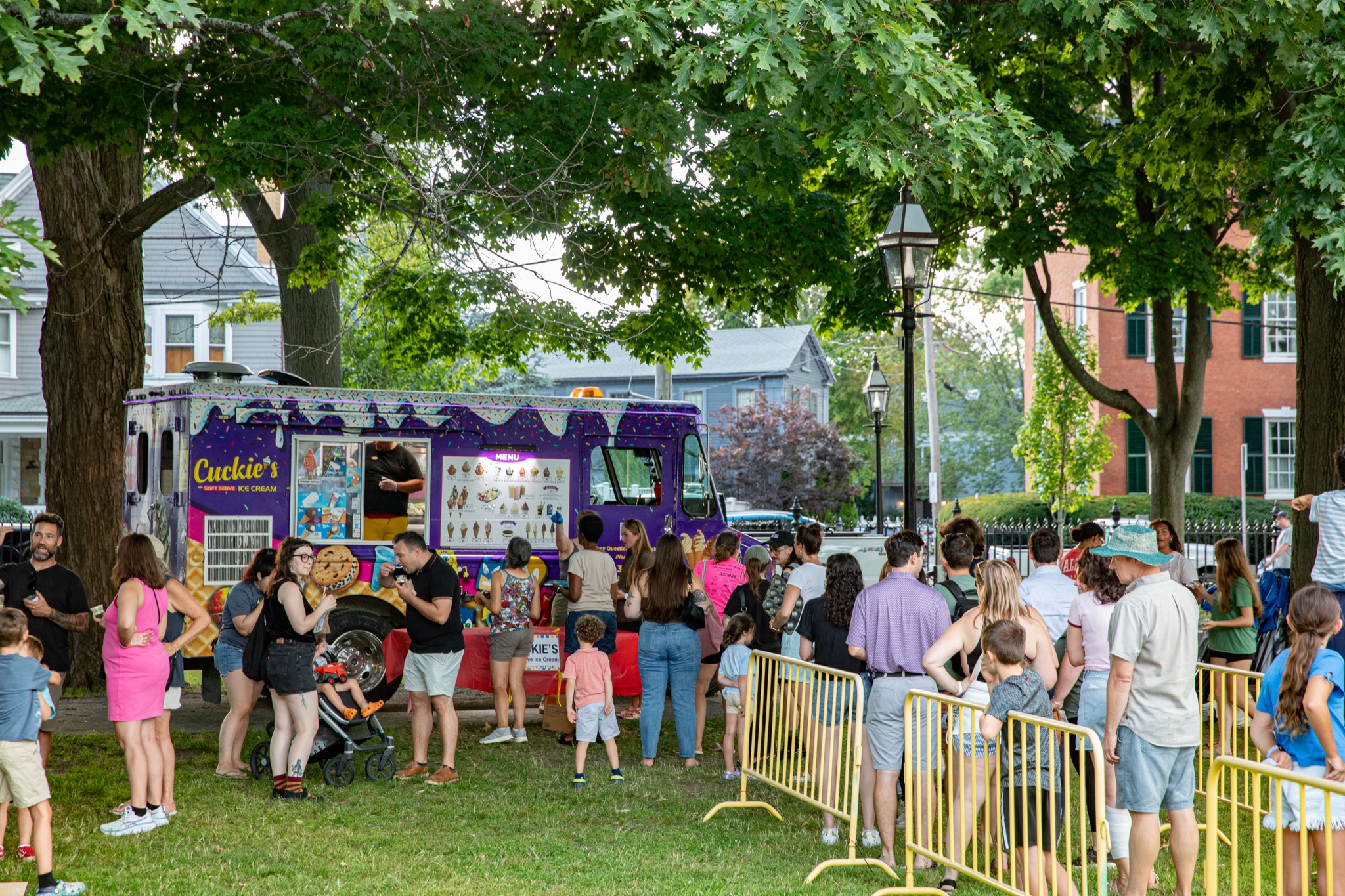 Crowd gathered around the purple Cuckie’s ice cream truck at the Ice Scream Bowl on Salem Common