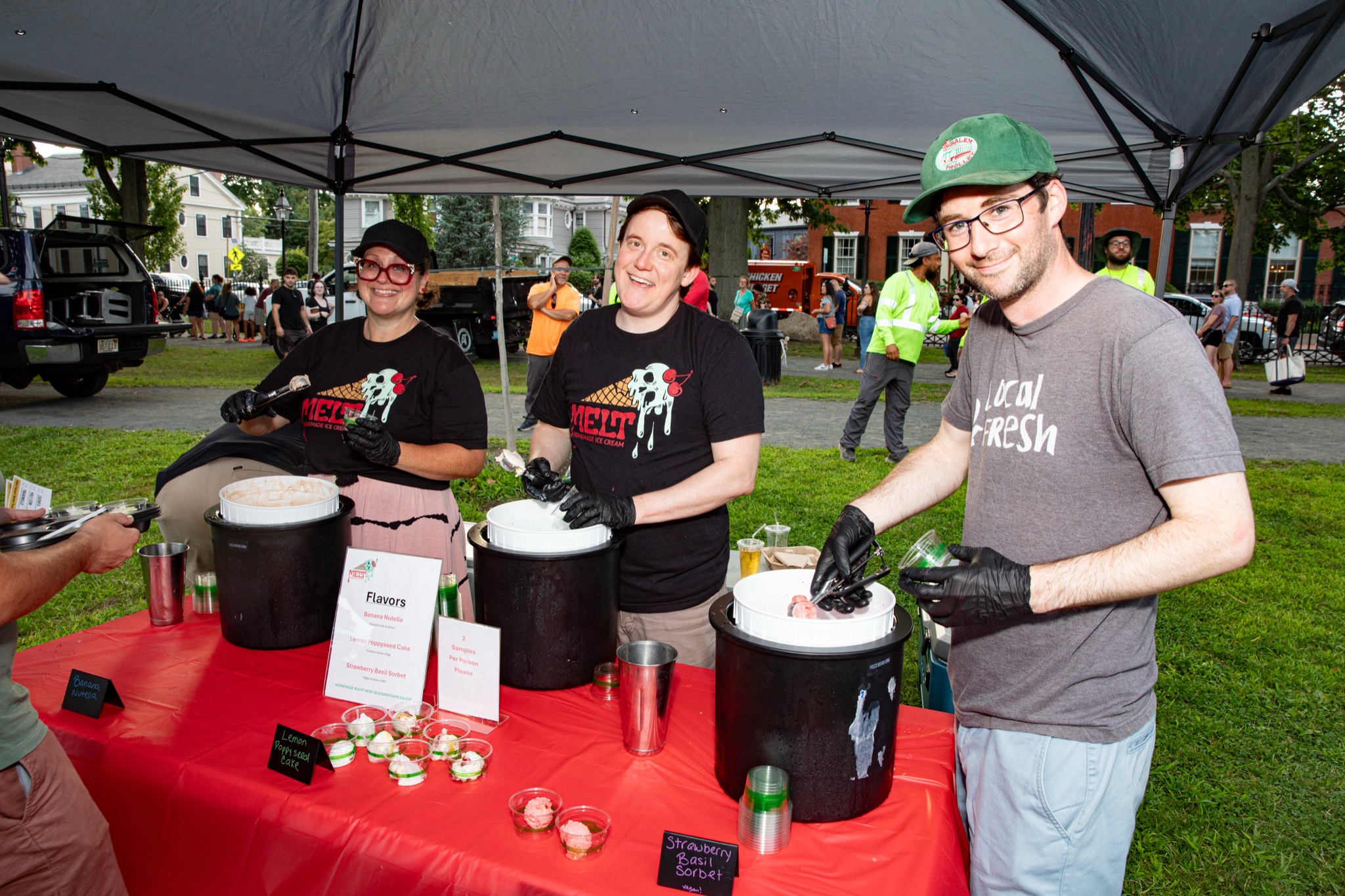 The Melt Ice Cream crew scooping sample cups at the Ice Scream Bowl on Salem Common