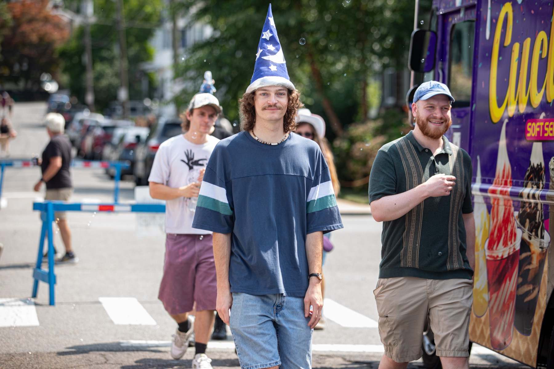 Festivalgoers walking between porch stages at Salem Porchfest in South Salem.