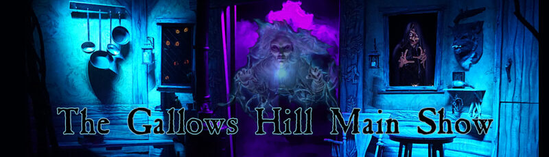 A dimly lit stage with blue and purple lighting shows kitchen utensils, eerie paintings, and a ghostly figure. Text reads, “Gallows Hill Presents: The Gallows Hill Main Show.”.