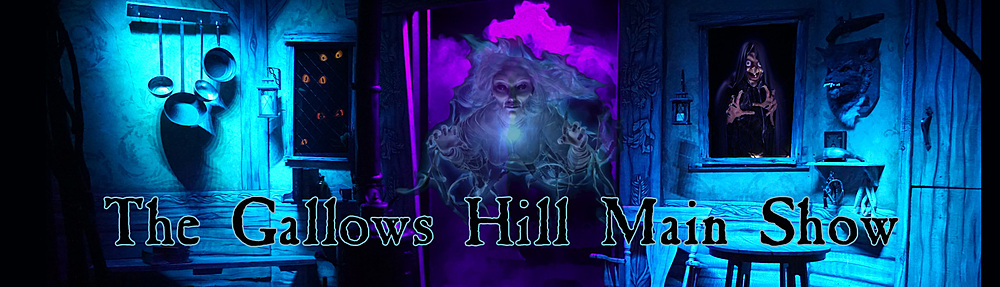 A dimly lit stage with blue and purple lighting shows kitchen utensils, eerie paintings, and a ghostly figure. Text reads, “Gallows Hill Presents: The Gallows Hill Main Show.”.