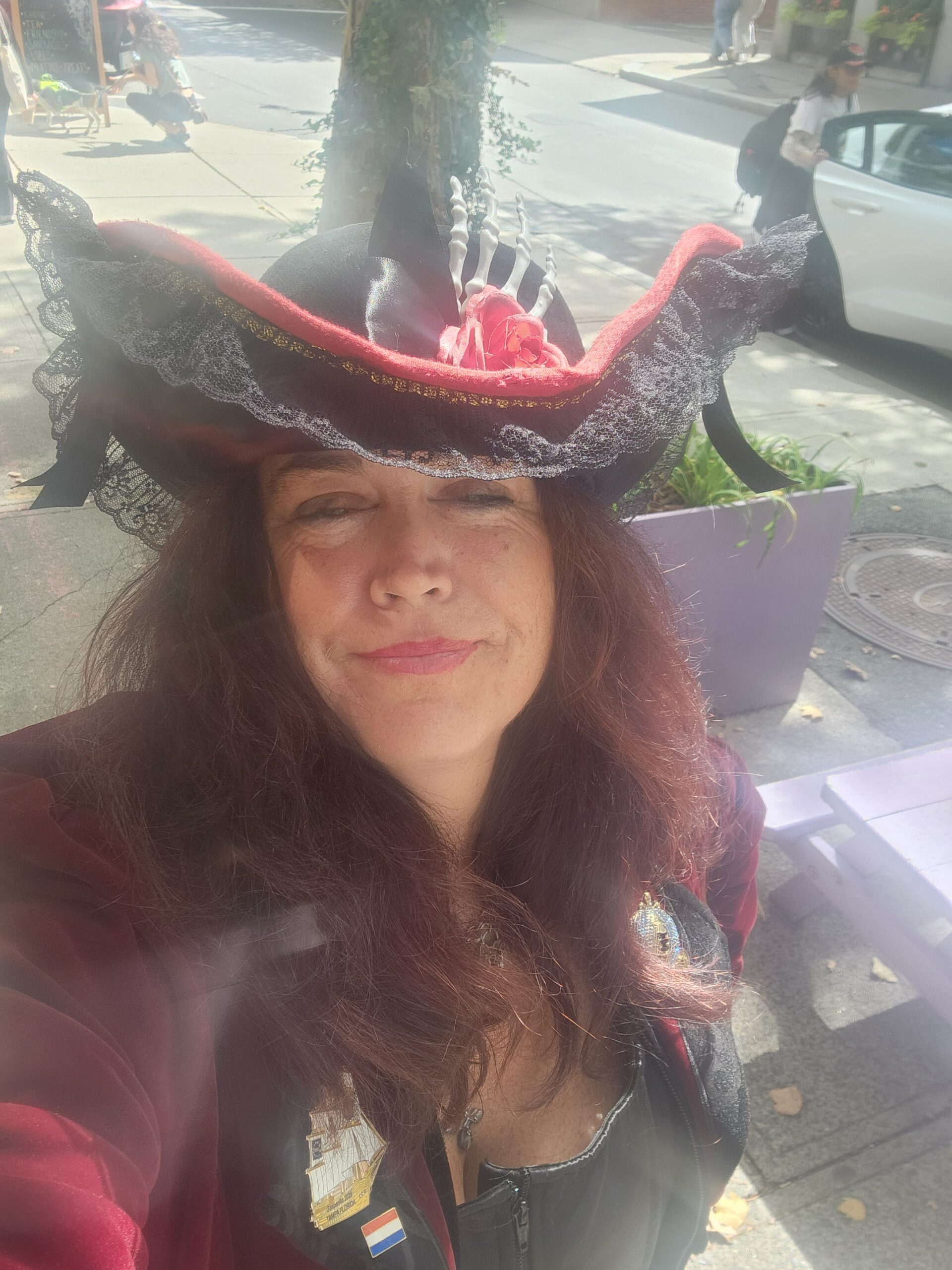 Stephanie Clements of Teller of Tales wearing a red and black pirate hat in Salem