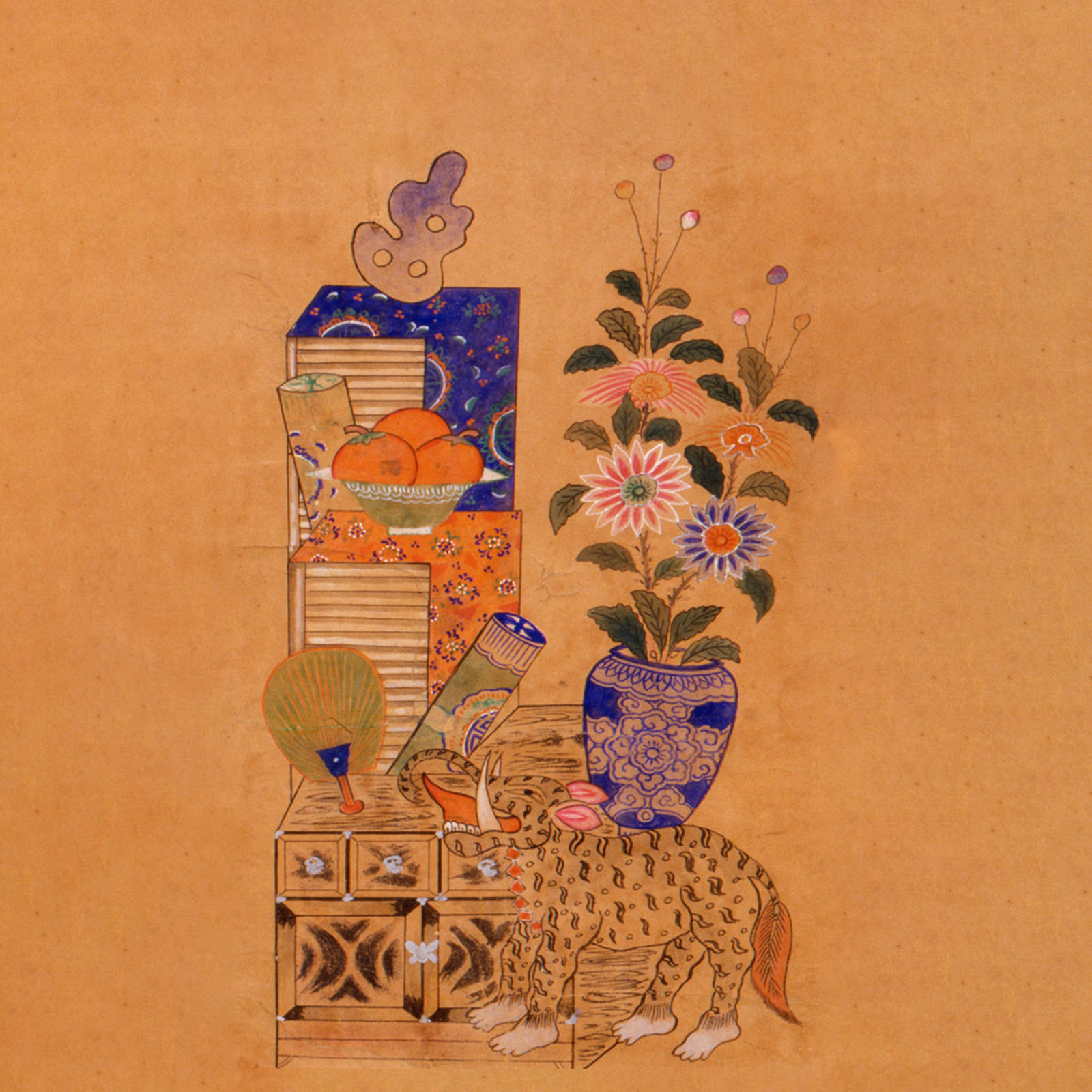 A painting shows a patterned blue vase with flowers, a stack of colorful boxes, fruit, fans, and a decorative mythical animal standing below on a wooden chest—objects often seen during Chuseok—set against a plain tan background.