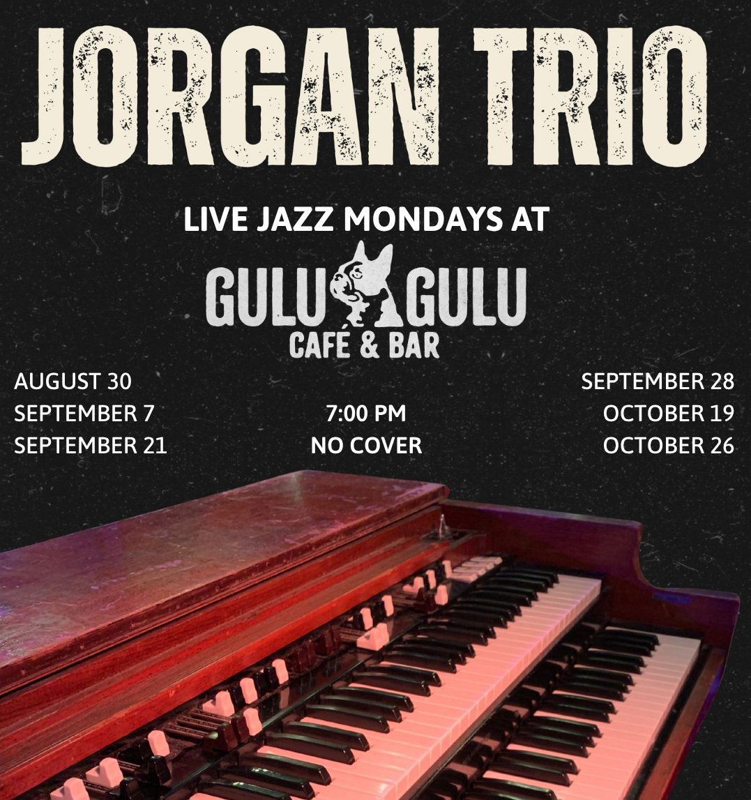 A close-up of a keyboard instrument in front of a dark background. Text above reads “Jorgan Trio” and advertises live jazz Mondays at Gulu Gulu Cafe & Bar, with show dates, 7:00 PM time, and “No Cover” listed.