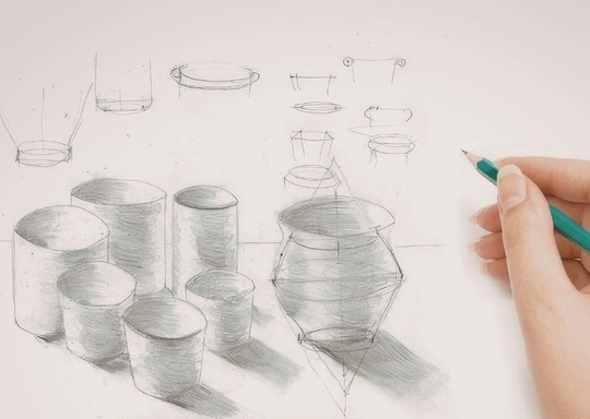 A hand holding a pencil sketches various cylindrical and round pottery shapes on white paper in a Studio Drawing session, with some vessels shaded and others shown as wireframe outlines and construction lines.