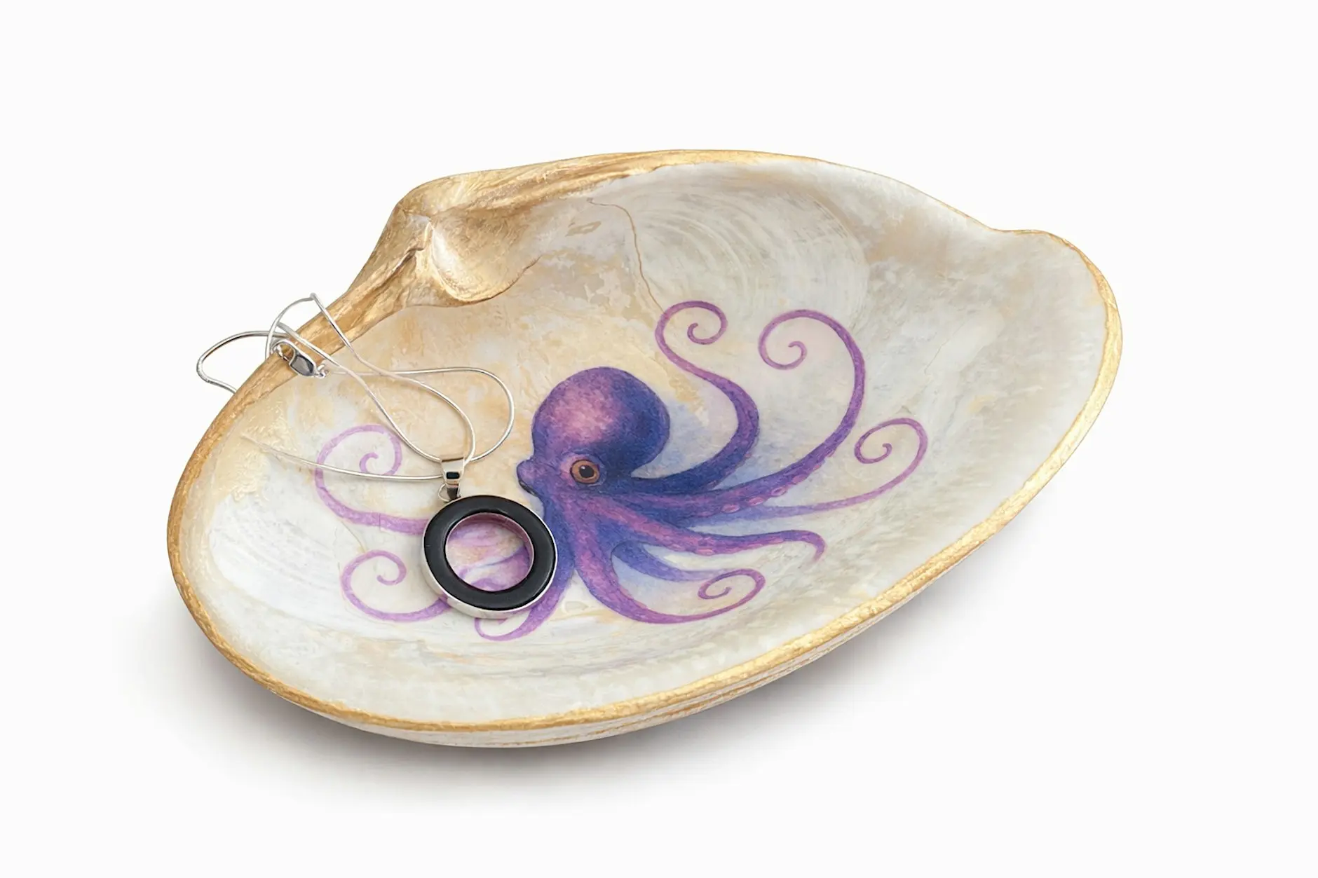 An Artful Shell pops up to reveal a painted purple octopus inside, cradling a necklace with a circular purple pendant. The background is plain white.