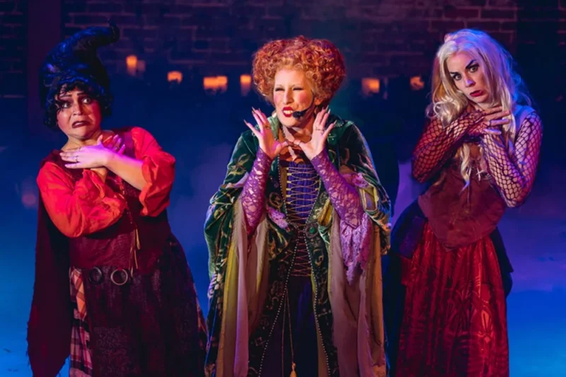 Three Rock Cauldron Cabaret performers as the Sanderson Sisters on stage.