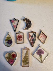 a group of nine pendants sitting on top of a table.