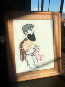 a picture of a man with a beard holding a child.