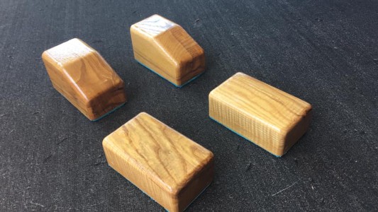 a group of wooden blocks sitting on top of a floor.
