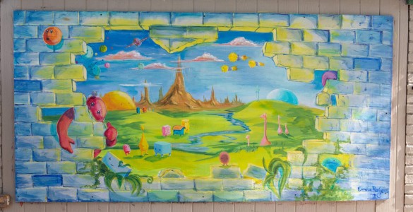 a picture of a painting on a brick wall.