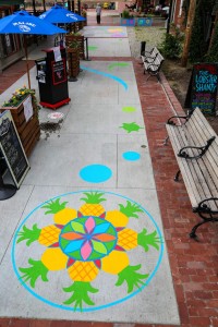 a sidewalk with a painted design on it.