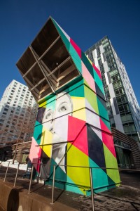 a colorful structure with a face painted on it.
