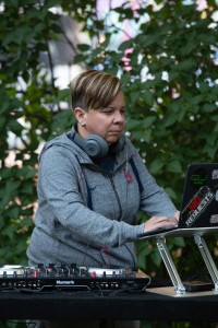 a woman with headphones on using a laptop.