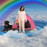 a woman and a dog are standing in the clouds with a tent and a rainbow.