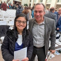 Salem Ma Inauguration 2026 - Salem Poet Laureate J.D. Scrimgeour and Youth Poet Laureate Liana Galvan at the 2026 Inauguration ceremony at Peabody Essex Museum. A young woman and older man beam with pride at a lively Essex County event, connecting with neighbors amid creative energy.